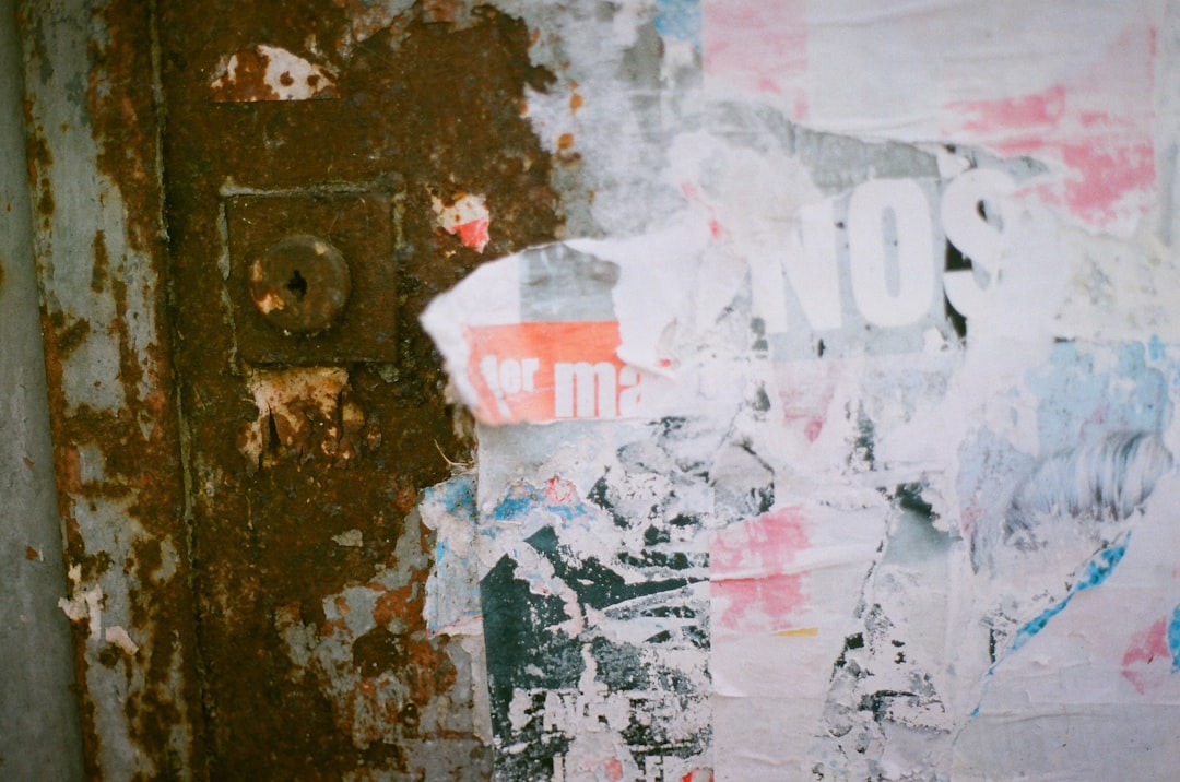 a hand holding a credit card and a cell phone